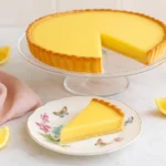 Finished lemon tart recipe with slice removed