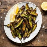 Shishito peppers air fryer appetizer served with lemon