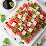 Watermelon feta checkerboard salad on white platter