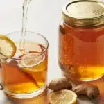 Canaan Honey Digestion: A Natural Boost for Your Gut 4 closeup of canaan honey jar with honey lemon ginger tea