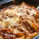 Delicious Classic Baked Ziti topped with cheese and herbs