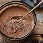 Delicious homemade hot chocolate mix in a jar with chocolate shavings and marshmallows.