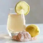 3 Ingredient Pink Salt Recipe The Morning Trick for Weight Loss, Detox, and All-Day Energy 14 Finished 3 ingredient pink salt recipe drink in a clear glass with lemon slice