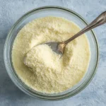 Thick spongy bloomed gelatin in bowl after 5 minutes hydration