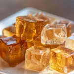 Rebel Wilson Gelatin Trick Recipe: 3 Ingredients That Actually Work 15 Rebel Wilson gelatin trick recipe cubes on white ceramic plate close up