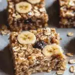 Delicious homemade Banana Oatmeal Bars on a wooden plate