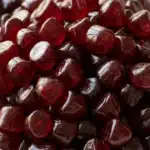 ashwagandha gummies benefits dark red cherry gummies in white ceramic bowl close up