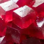 Dr Gupta gelatin recipe set into pink ruby cubes in a clean white ceramic bowl