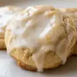 3 Ingredient Sugar Cookies: 7 Easy Baking Secrets 18 3 ingredient sugar cookies with icing close up on white plate