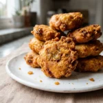 African banana trick fritters golden and crispy on a plate