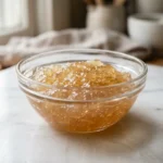 Bloomed gelatin in a glass bowl showing soft swollen texture